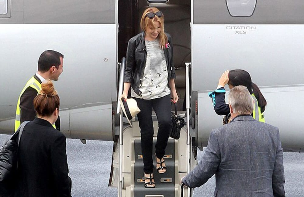 Kylie Minogue departing a jet