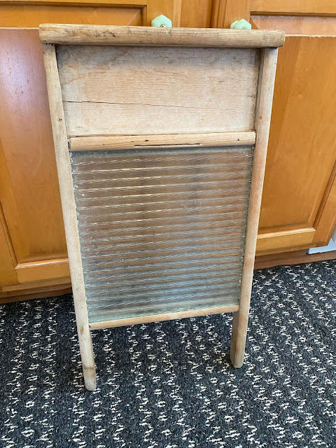 Photo of a vintage, well used washboard.