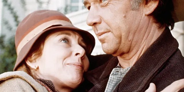 Actress Michael Learned embraces actor Ralph Waite in scene from the TV series "The Waltons."
