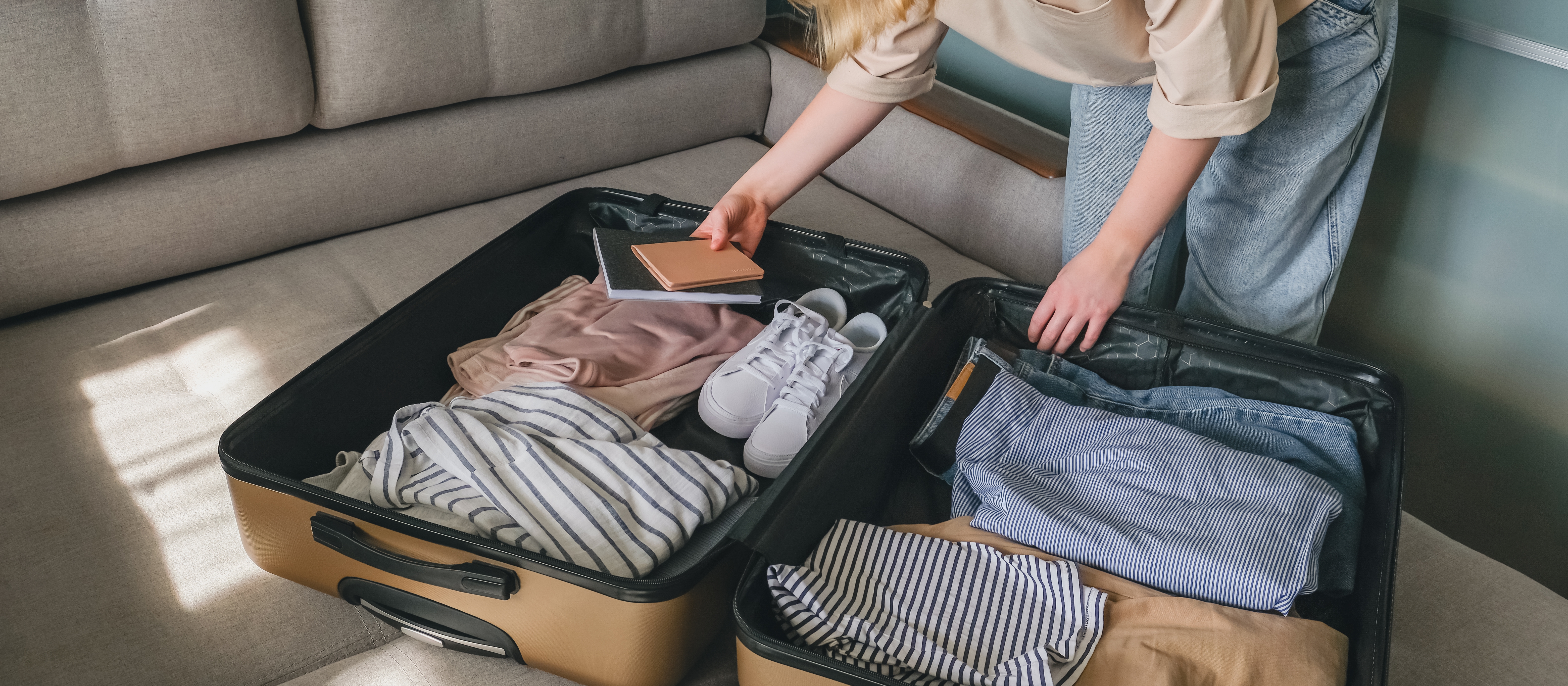 A woman packing a suitcase | Source: Shutterstock