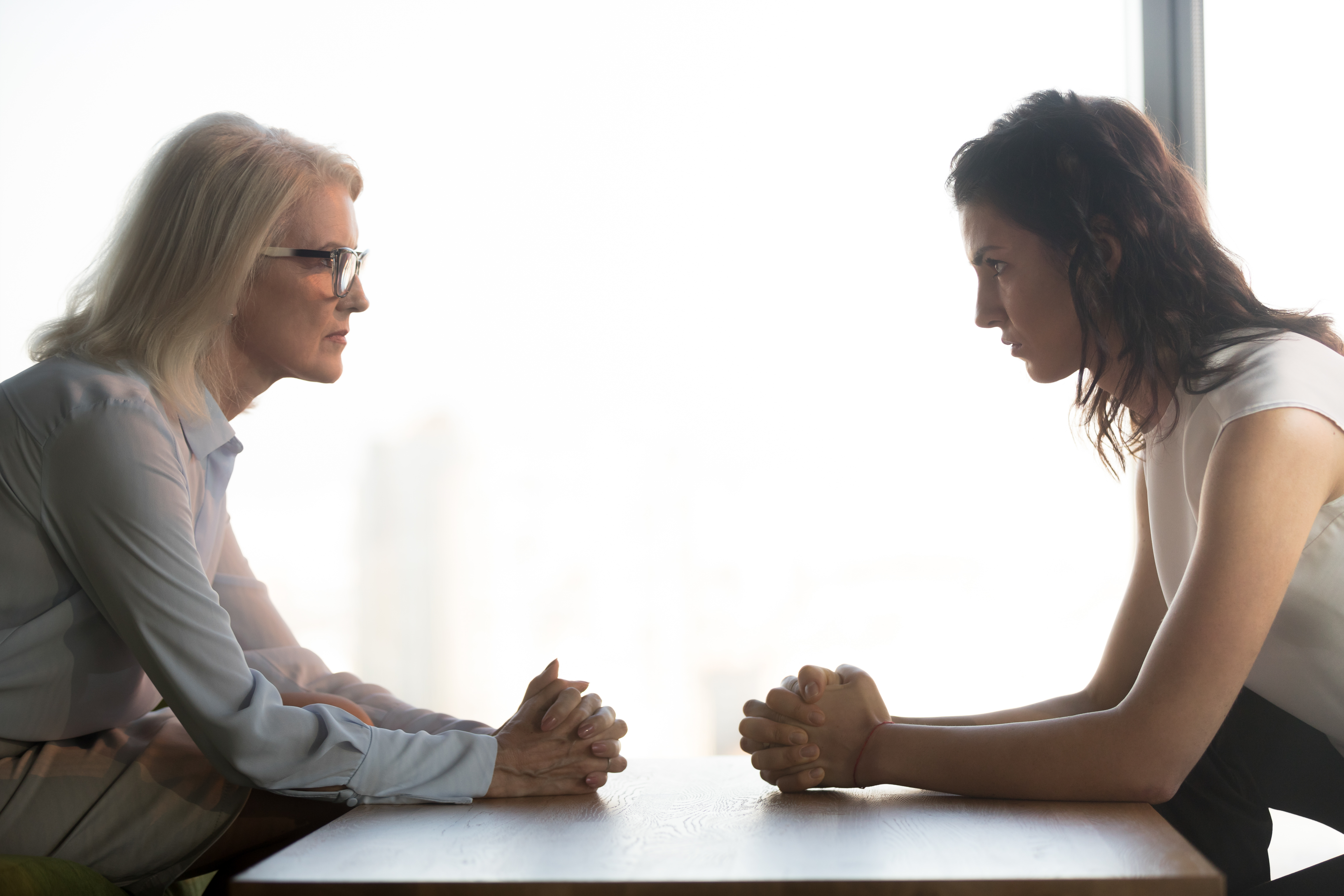 Two women looking angrily at each other | Source: Shutterstock