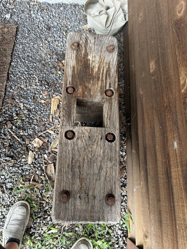 r/whatisthisthing - Wooden bench with a hole in the middle. The bolts go all the way through the legs and it is very heavy. Found in the basement of an old farm house