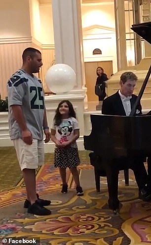 Volunteer firefighter belts out Ave Maria at Disney World while his  daughter watches on | Daily Mail Online