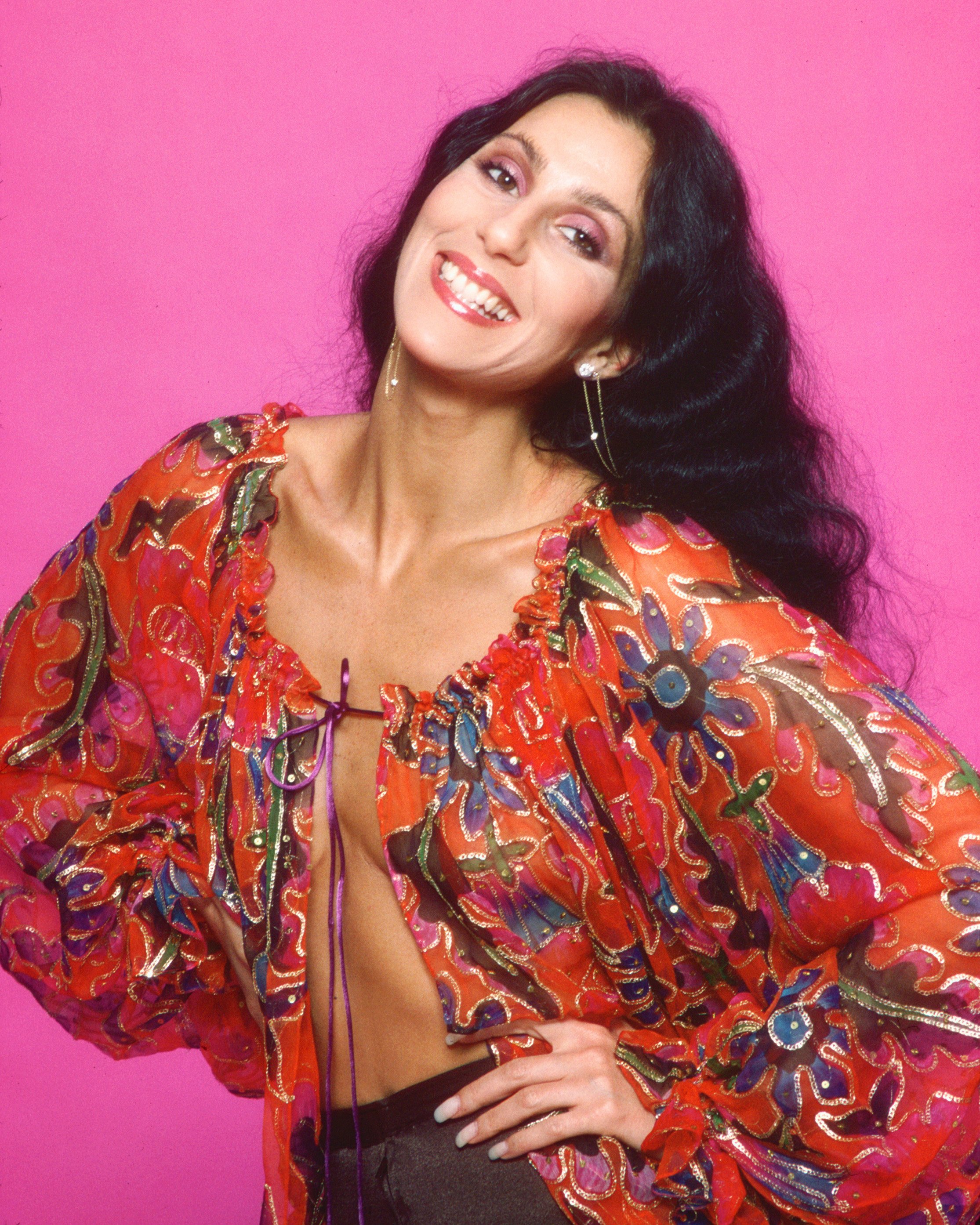 Cher poses for a photo session in a Bob Mackie blouse in Los Angeles, California, on March 21, 1977. | Source: Getty Images