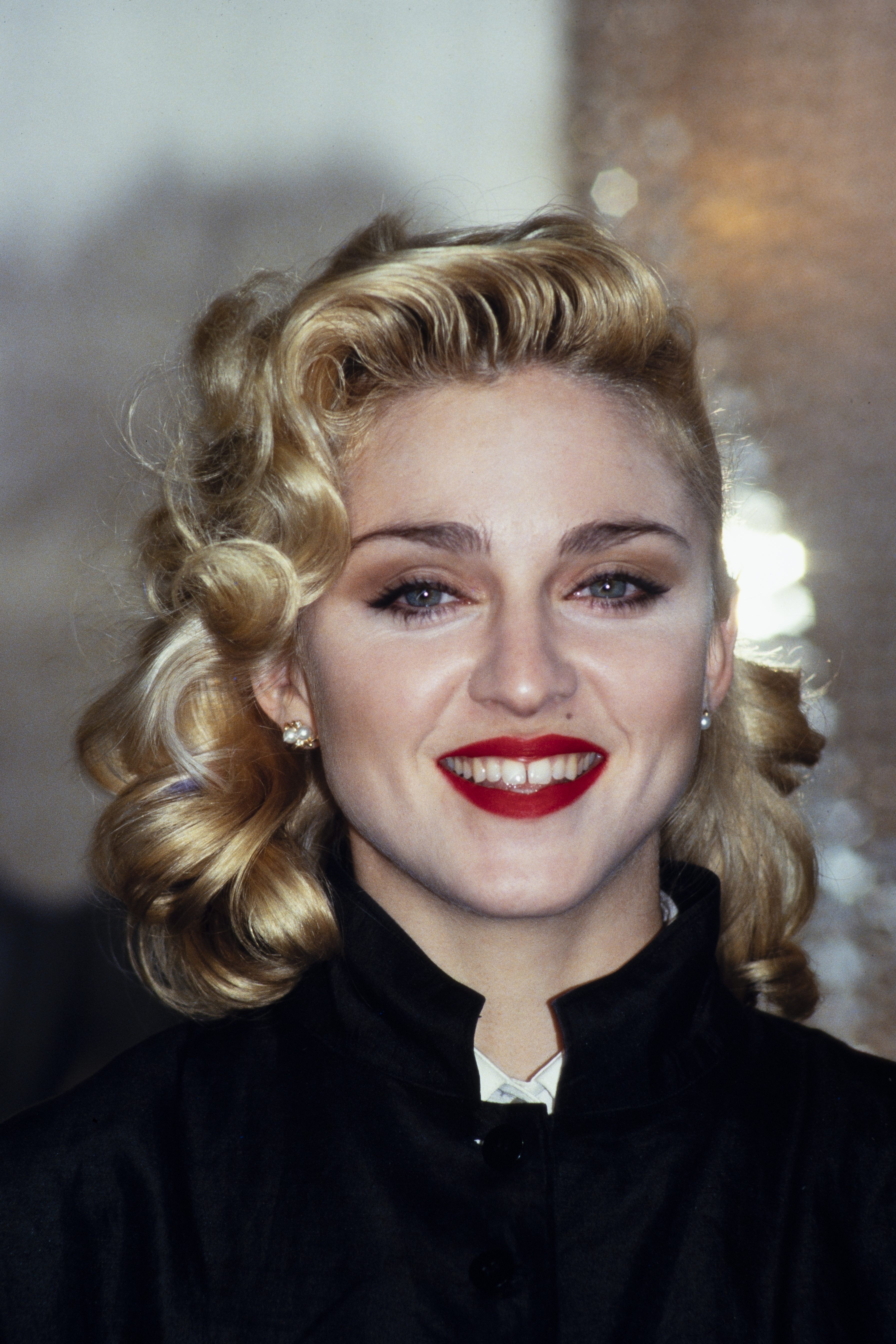 Madonna holds a Press Conference with former Beatle George Harrison for their film "Shanghai Surprise" at the Kensington Roof Gardens in London on March 6, 1986. | Source: Getty Images