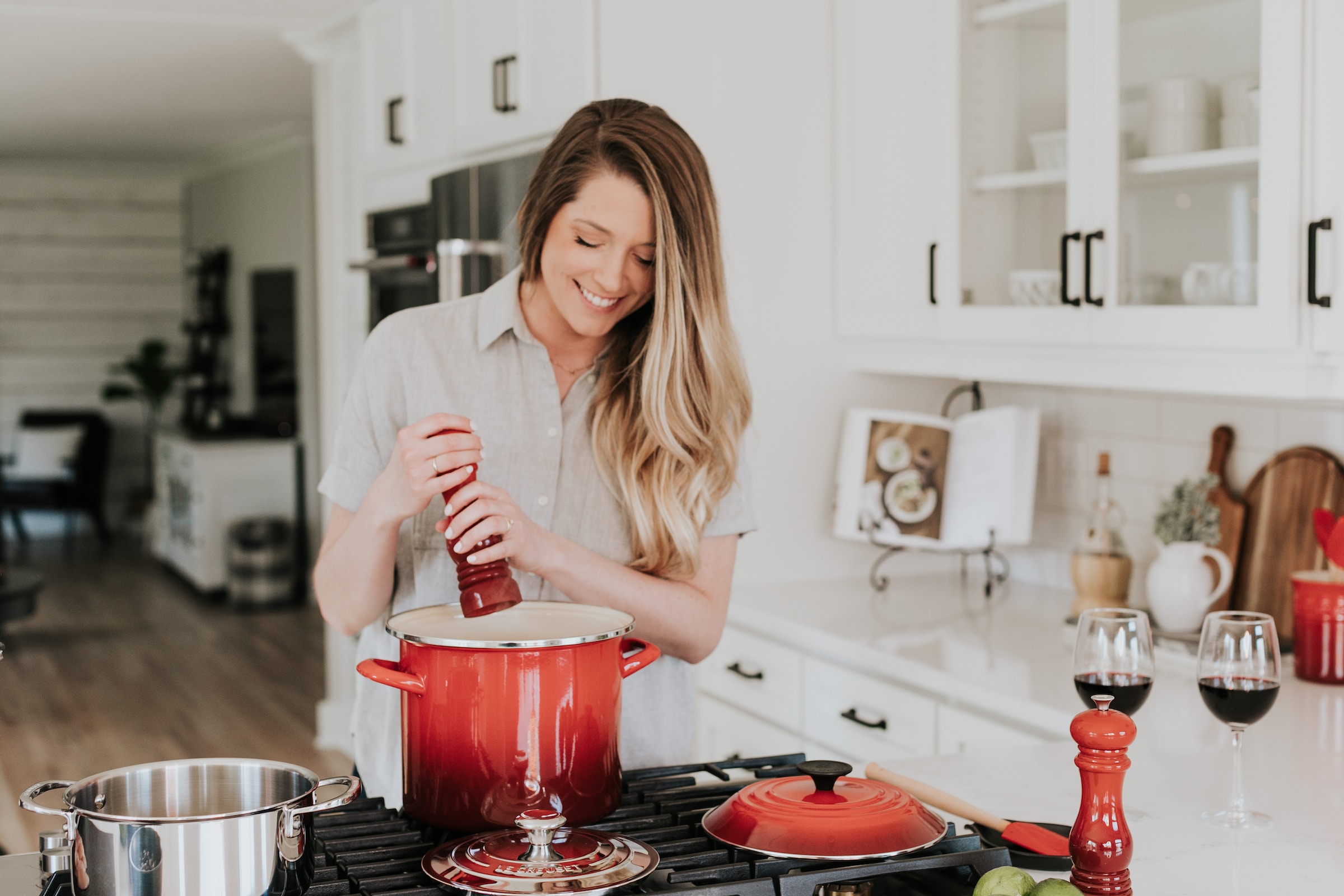 Woman cooking in kitchen | Source: Unsplash