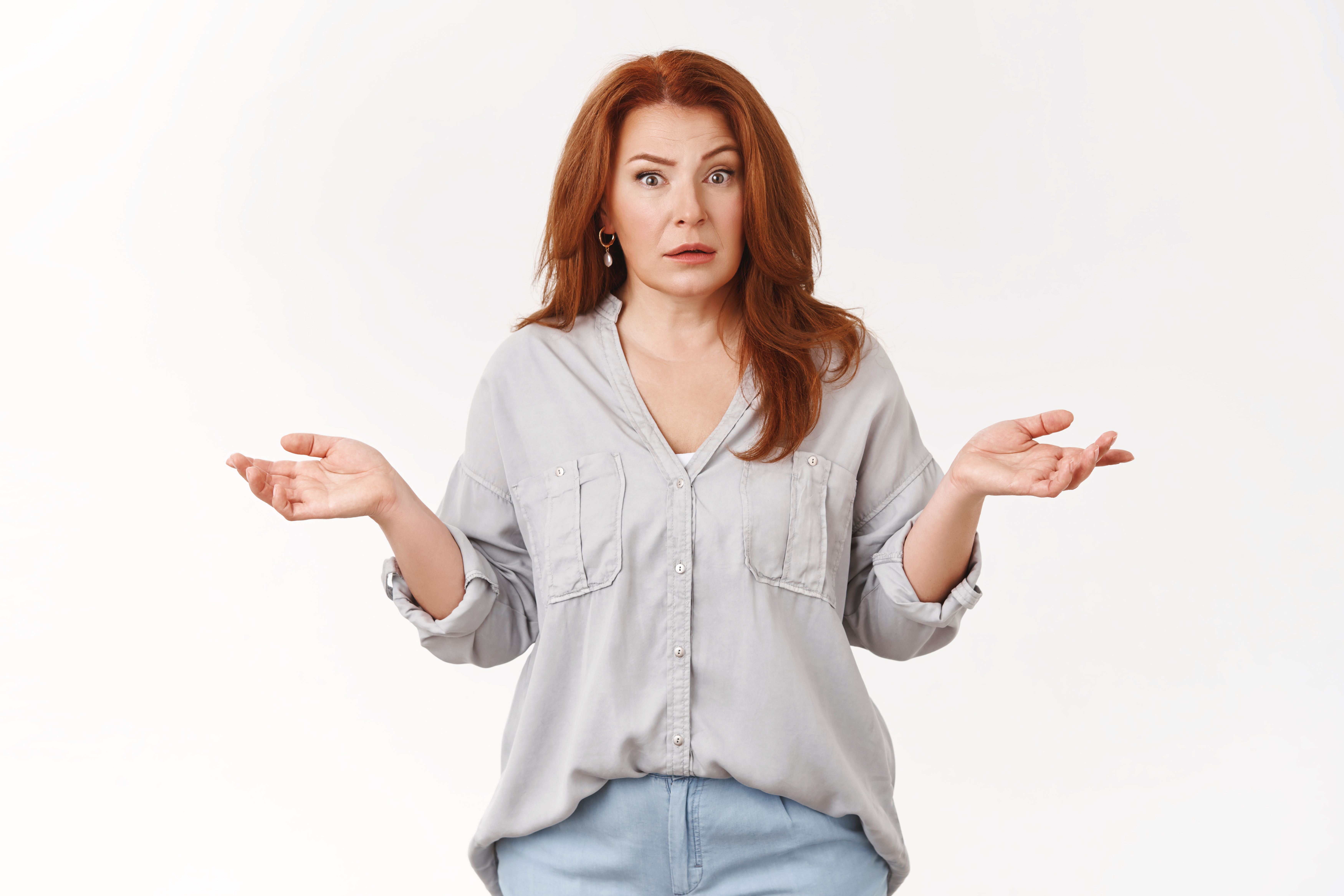 A confused woman with her hands in the air | Source: Shutterstock