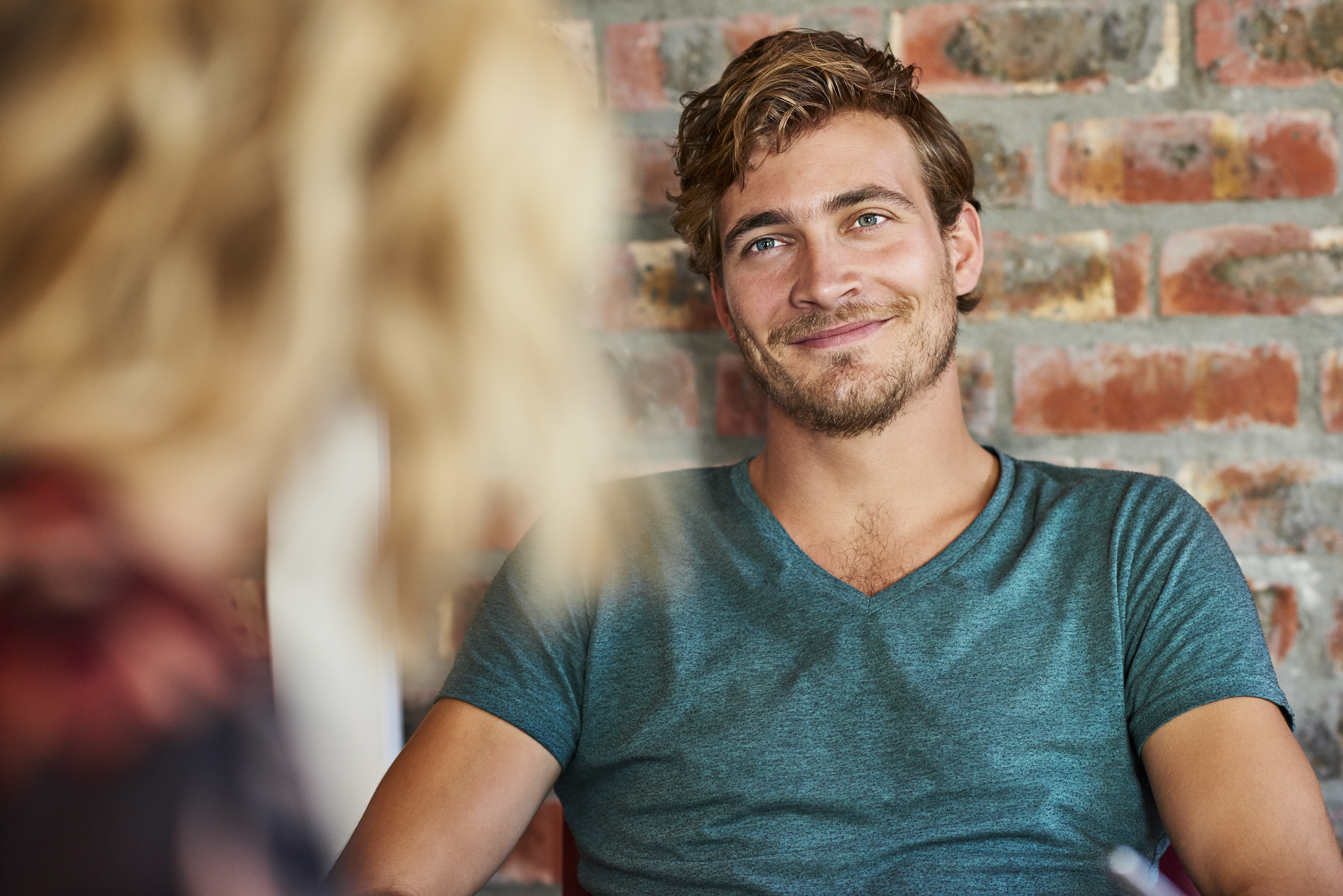 Loving young man looking at woman in house | Source: Getty Images