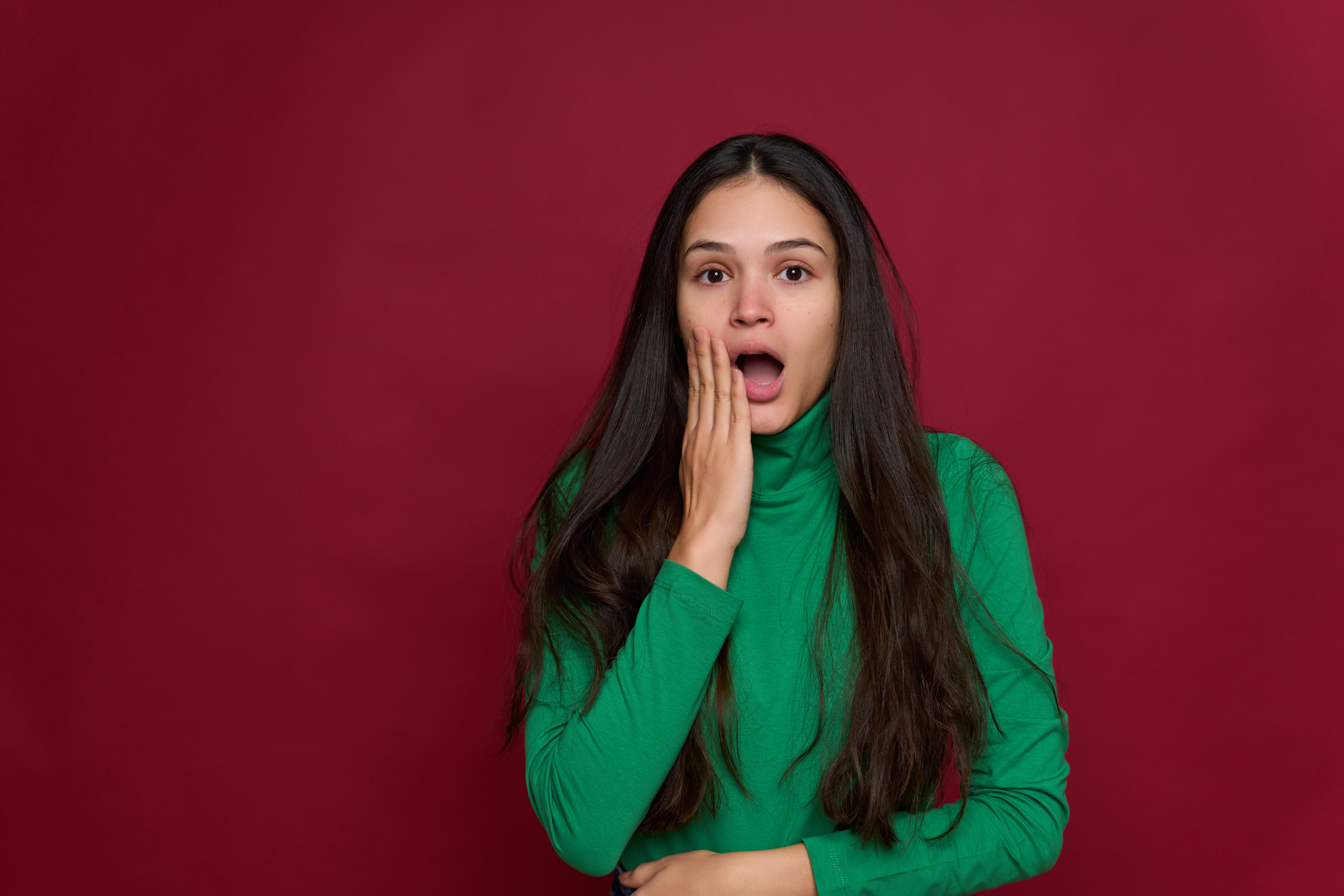 Young woman looking scared over isolated background | Source: Getty Images