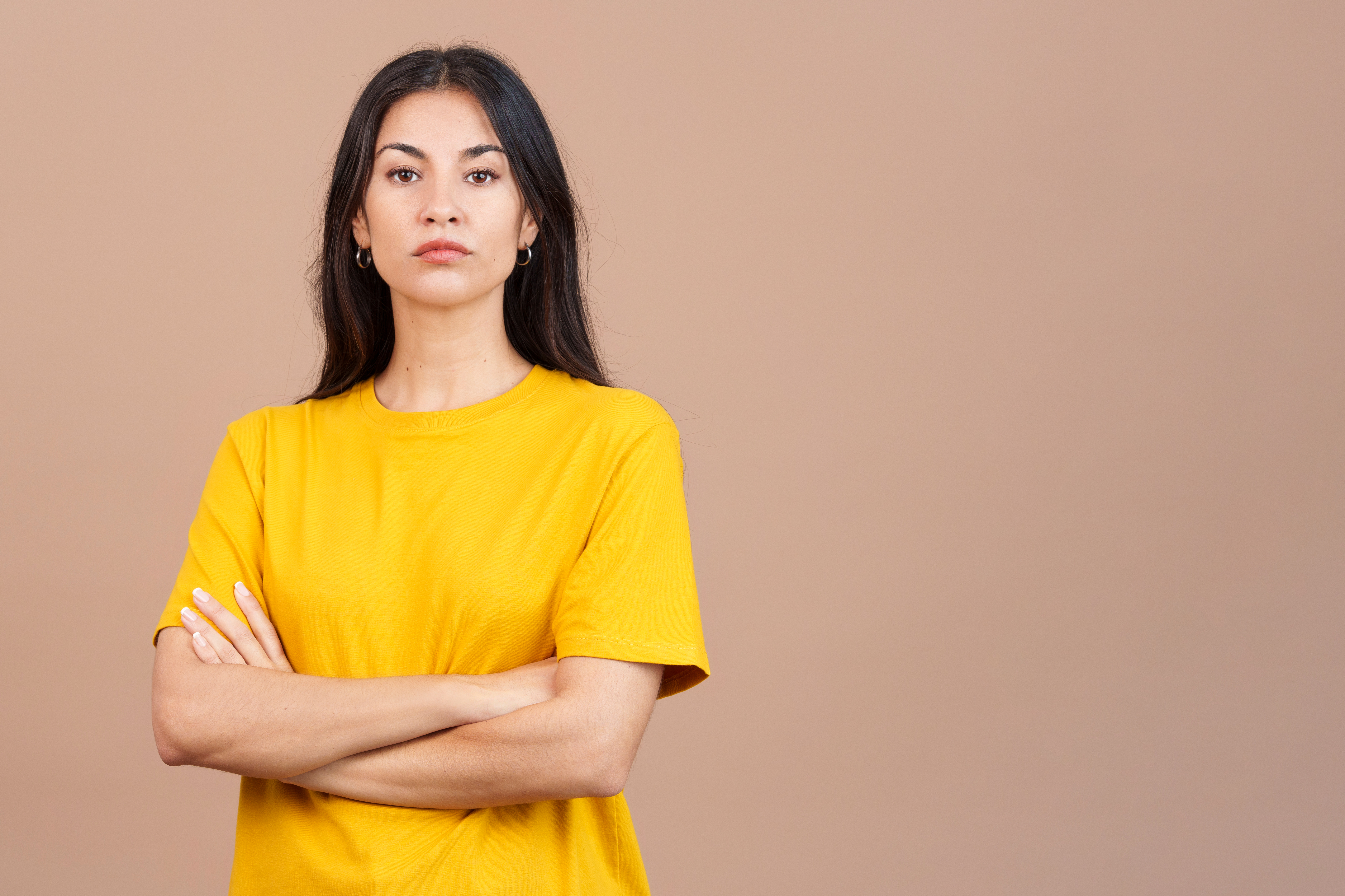 Caucasian woman crossing the arms with an angry expression | Source: Getty Images