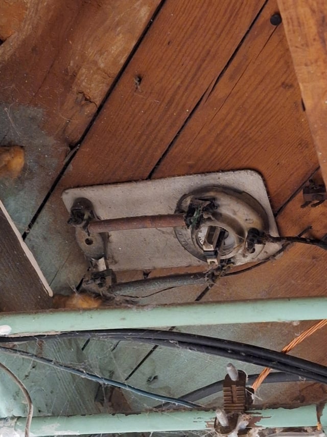 r/whatisthisthing - Strange ceramic plate on basement ceiling under kitchen? 103 year old house