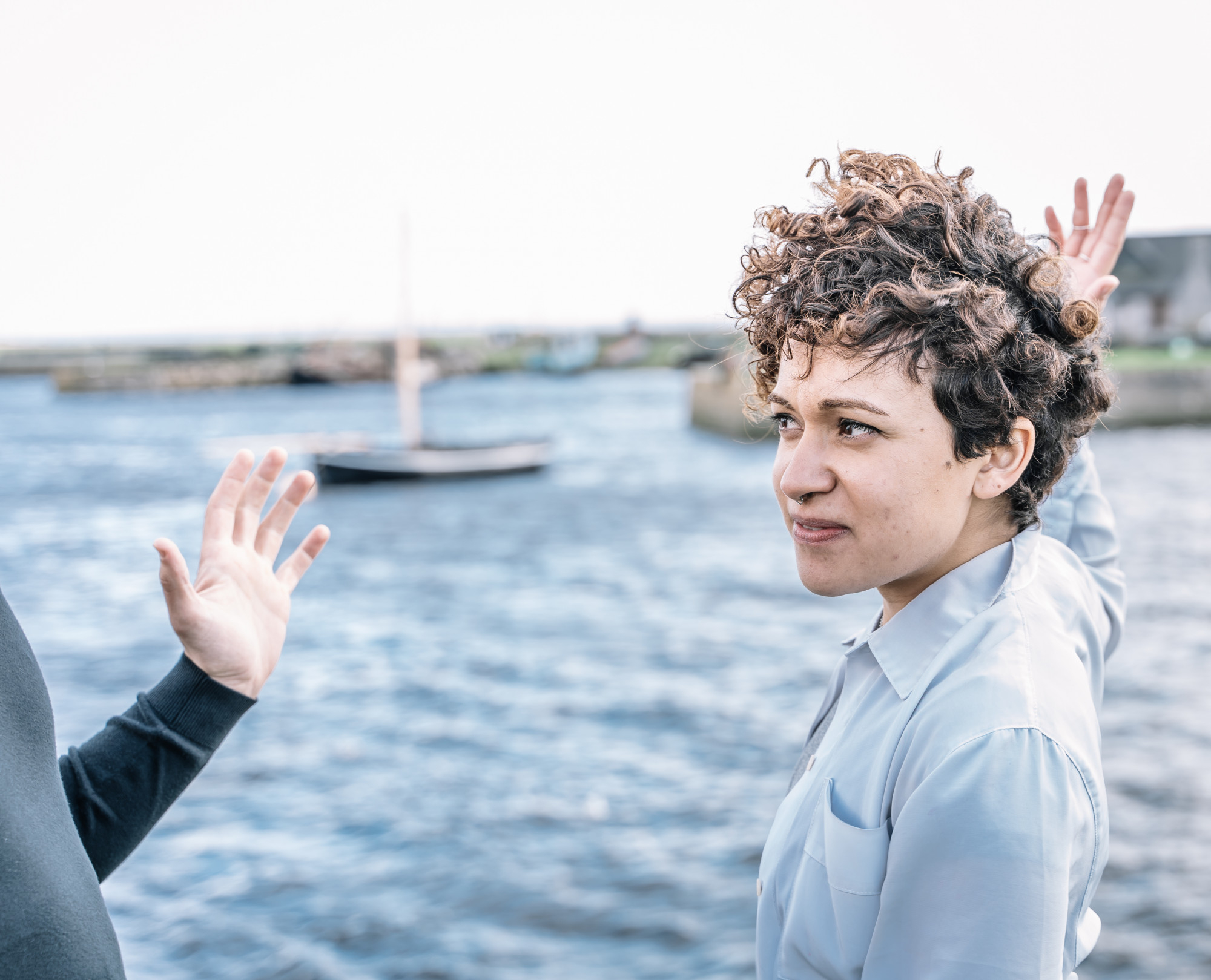 A couple arguing by the beach | Source: Freepik