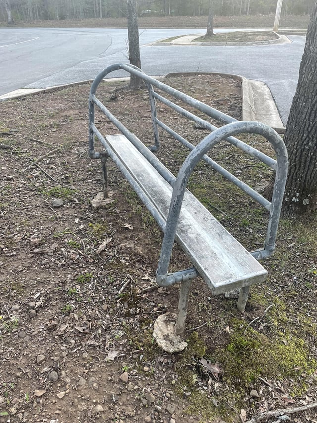 r/whatisthisthing - Strange “bench” with tubing near the parking lot of an old elementary school